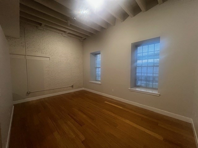33 3rd Avenue, Unit U214 Boston, MA 02129 - Photo 9 of 17 a view of an empty room with wooden floor and a window
