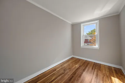 a bathroom with a sink a mirror and a toilet