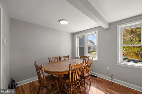 a bedroom with a bed and a large mirror