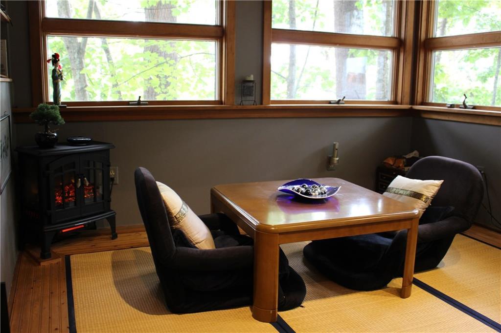47 Mayberry Road Gray, ME 04039 - Photo 12 of 35 Electric woodstove and Tatami mat.