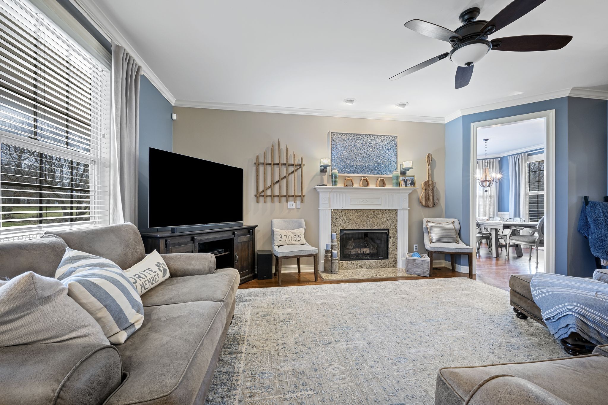 194 Fairview Road Dickson, TN 37055 - Photo 11 of 63 a living room with furniture a fireplace and a flat screen tv