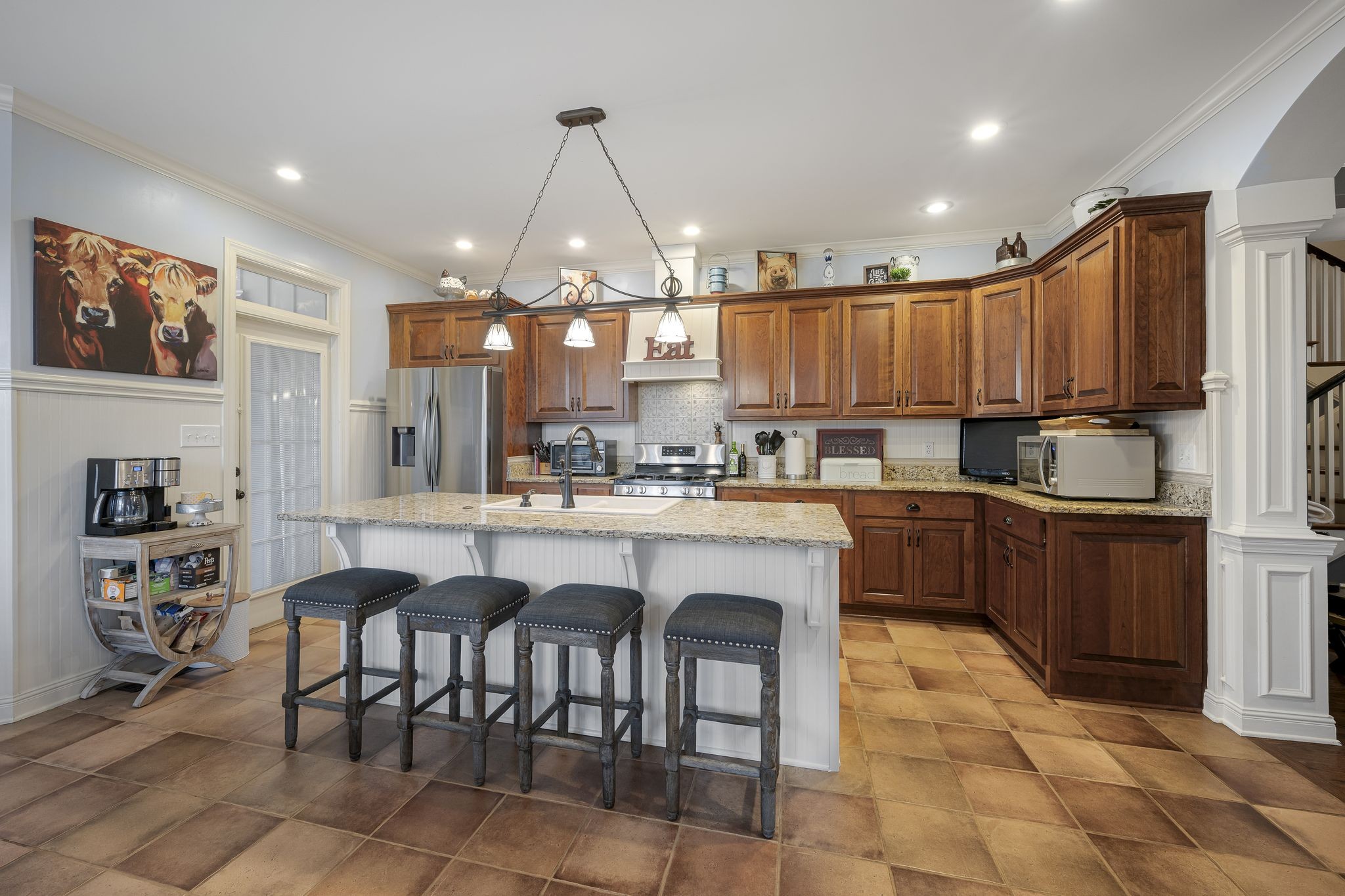 194 Fairview Road Dickson, TN 37055 - Photo 17 of 63 a kitchen with granite countertop a stove a sink a counter space and cabinets