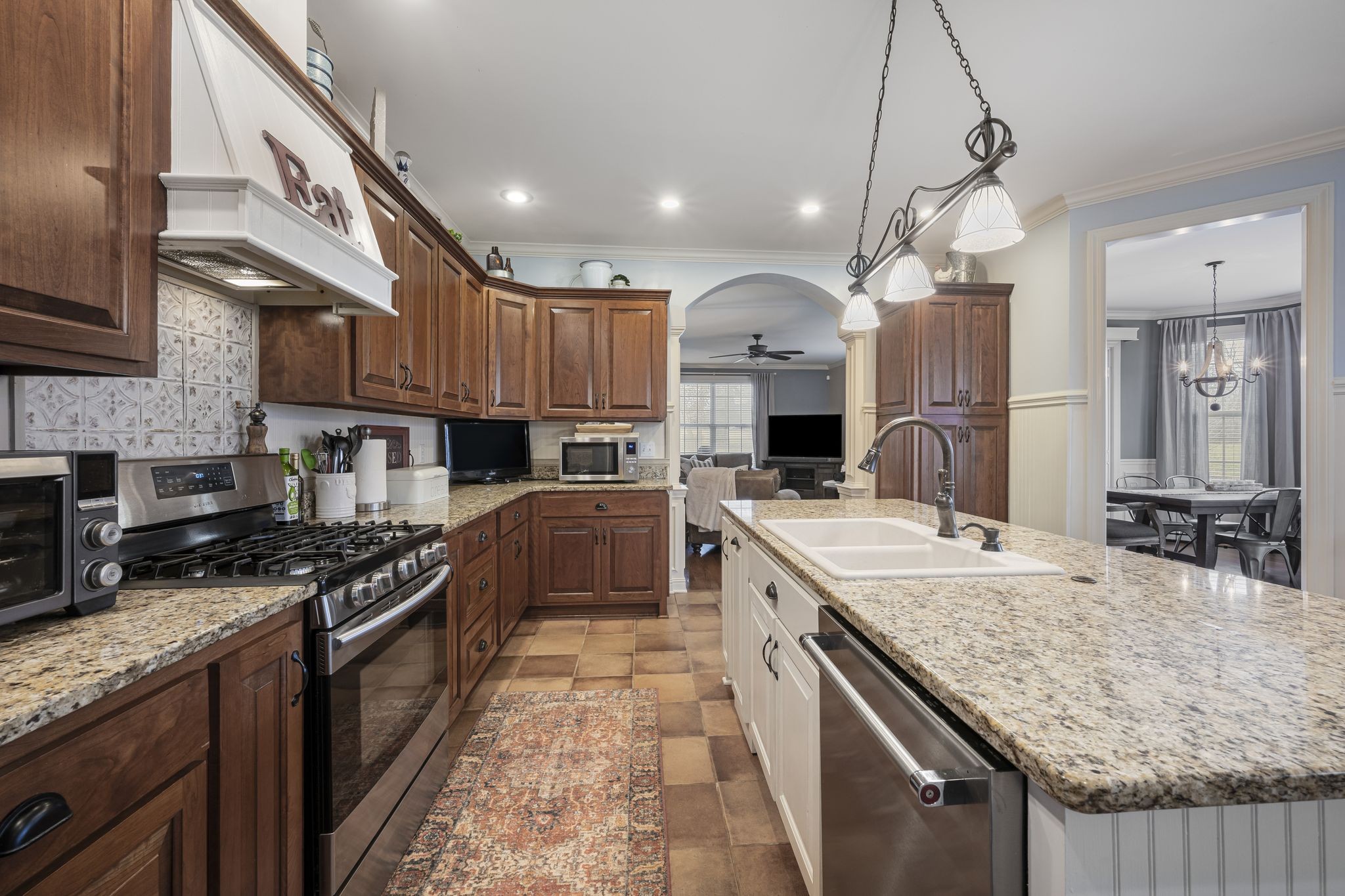 194 Fairview Road Dickson, TN 37055 - Photo 19 of 63 a kitchen with stainless steel appliances granite countertop a sink a stove and a refrigerator