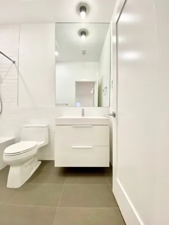 a bathroom with a sink a toilet and a bathtub