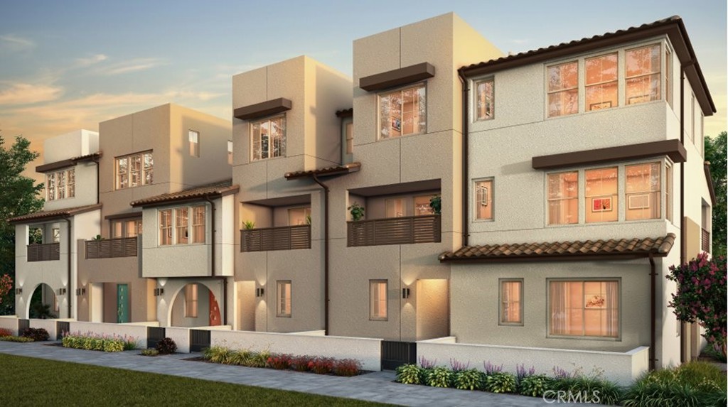 61 Harness Way Rancho Mission Viejo, CA 92694 - Photo 20 of 25 a front view of a residential apartment building with a yard