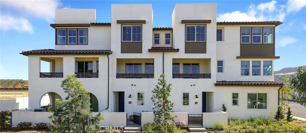 61 Harness Way Rancho Mission Viejo, CA 92694 - Photo 21 of 25 a front view of a multi story residential apartment building
