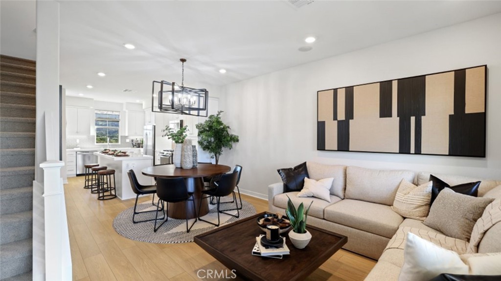 61 Harness Way Rancho Mission Viejo, CA 92694 - Photo 9 of 25 a living room with furniture and a chandelier