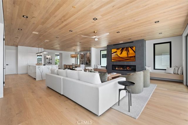 a view of walk in closet with clothes