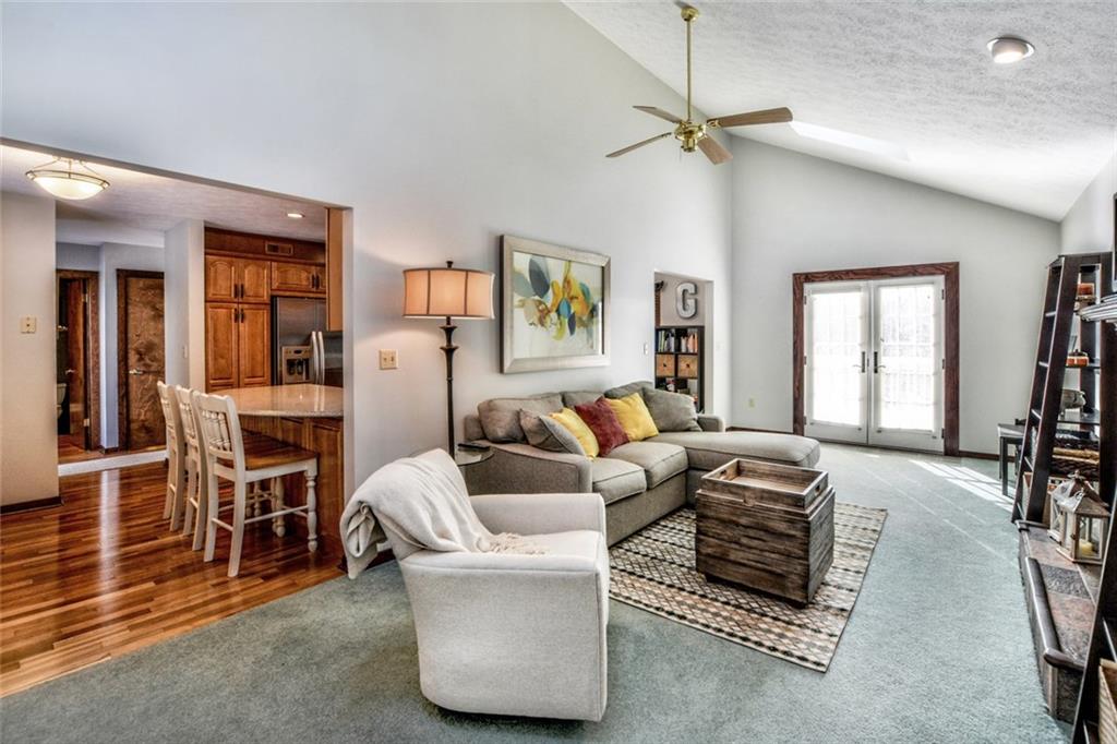 5099 West Harbison Road Pittsburgh, PA 15276 - Photo 4 of 20 Cozy yet large living room with gas fire place and vaulted ceiling with skylights.