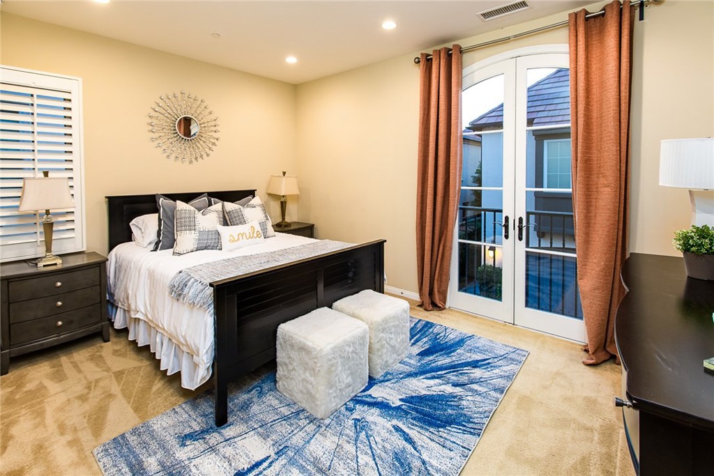 75 Gardenstone Path Irvine, CA 92620 - Photo 19 of 65 a bedroom with a bed and a large window