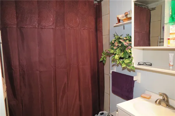 a bathroom with a sink and mirror