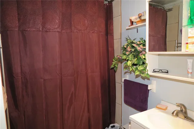 a bathroom with a sink and mirror