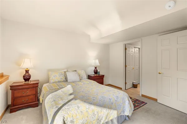 a bedroom with a bed and a closet