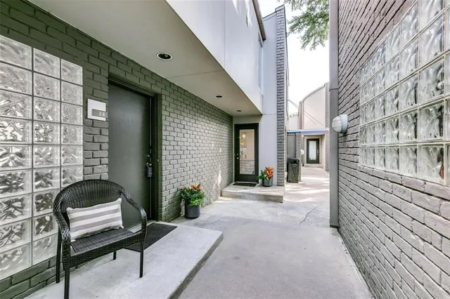 a entryway of a house with outdoor seating