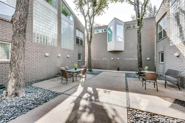 a patio with table and chairs