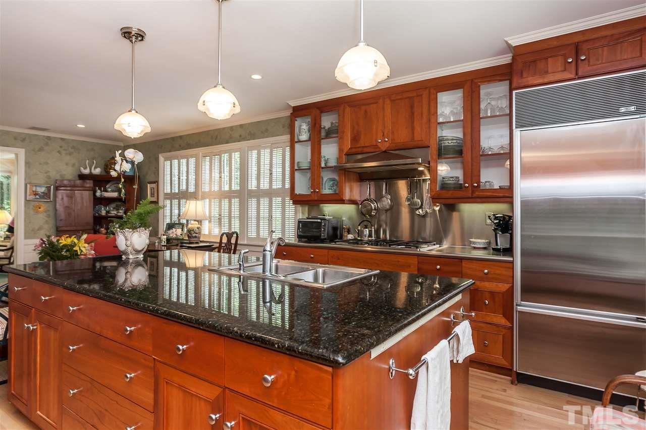 3313 Landor Road Raleigh, NC 27609 - Photo 11 of 25 a kitchen with stainless steel appliances granite countertop a refrigerator a sink and a stove