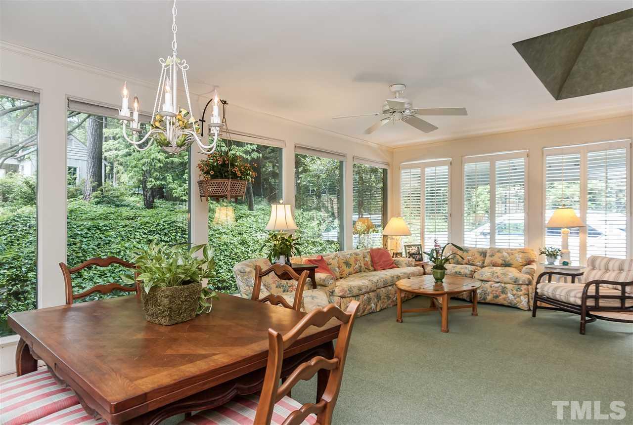 3313 Landor Road Raleigh, NC 27609 - Photo 12 of 25 a living room with furniture and a potted plant