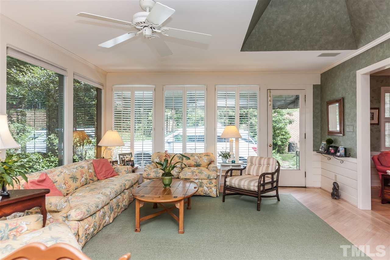 3313 Landor Road Raleigh, NC 27609 - Photo 13 of 25 a living room with furniture and floor to ceiling windows