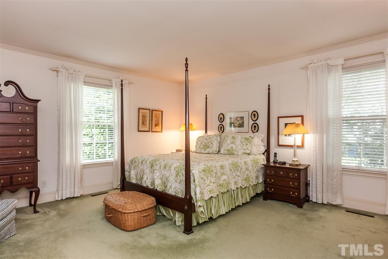 3313 Landor Road Raleigh, NC 27609 - Photo 14 of 25 a spacious bedroom with a bed and a window