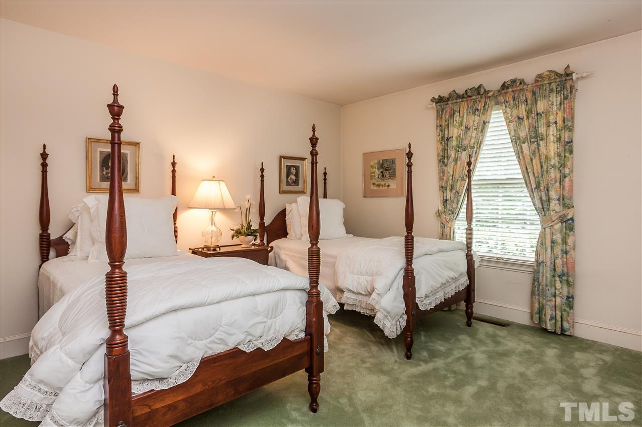 3313 Landor Road Raleigh, NC 27609 - Photo 16 of 25 a bedroom with a bed and a window
