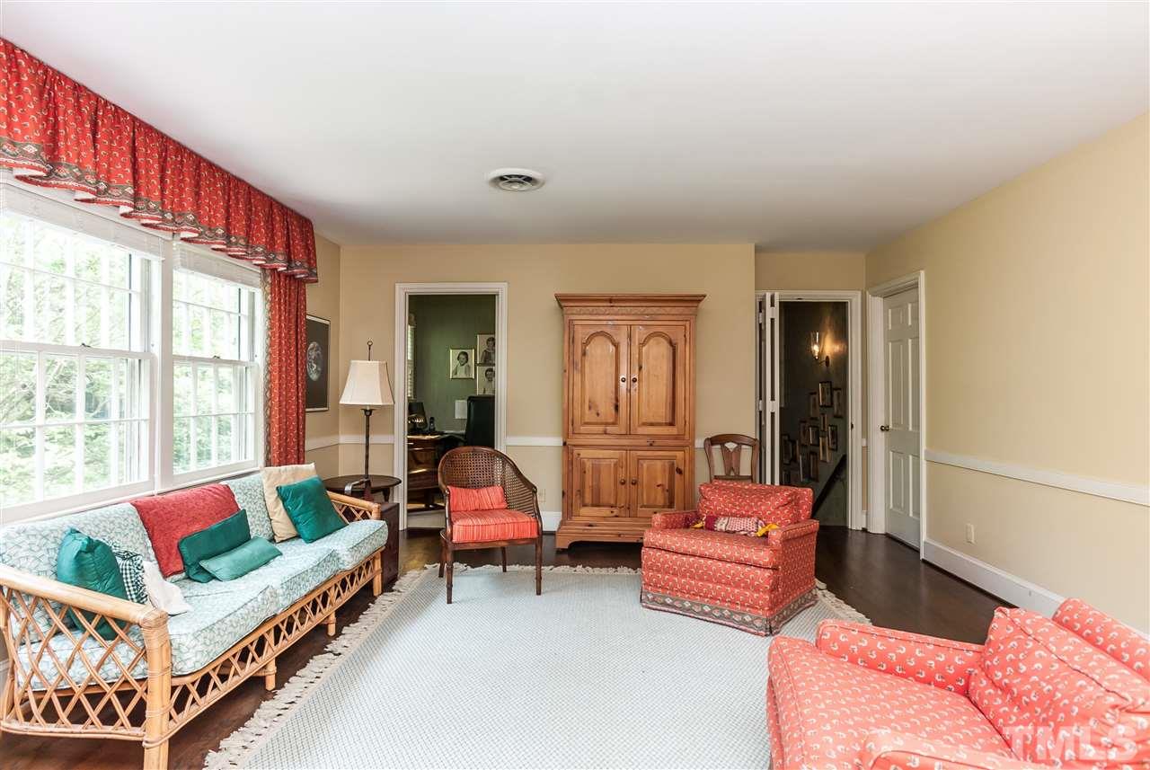 3313 Landor Road Raleigh, NC 27609 - Photo 19 of 25 a bedroom with furniture and a large window