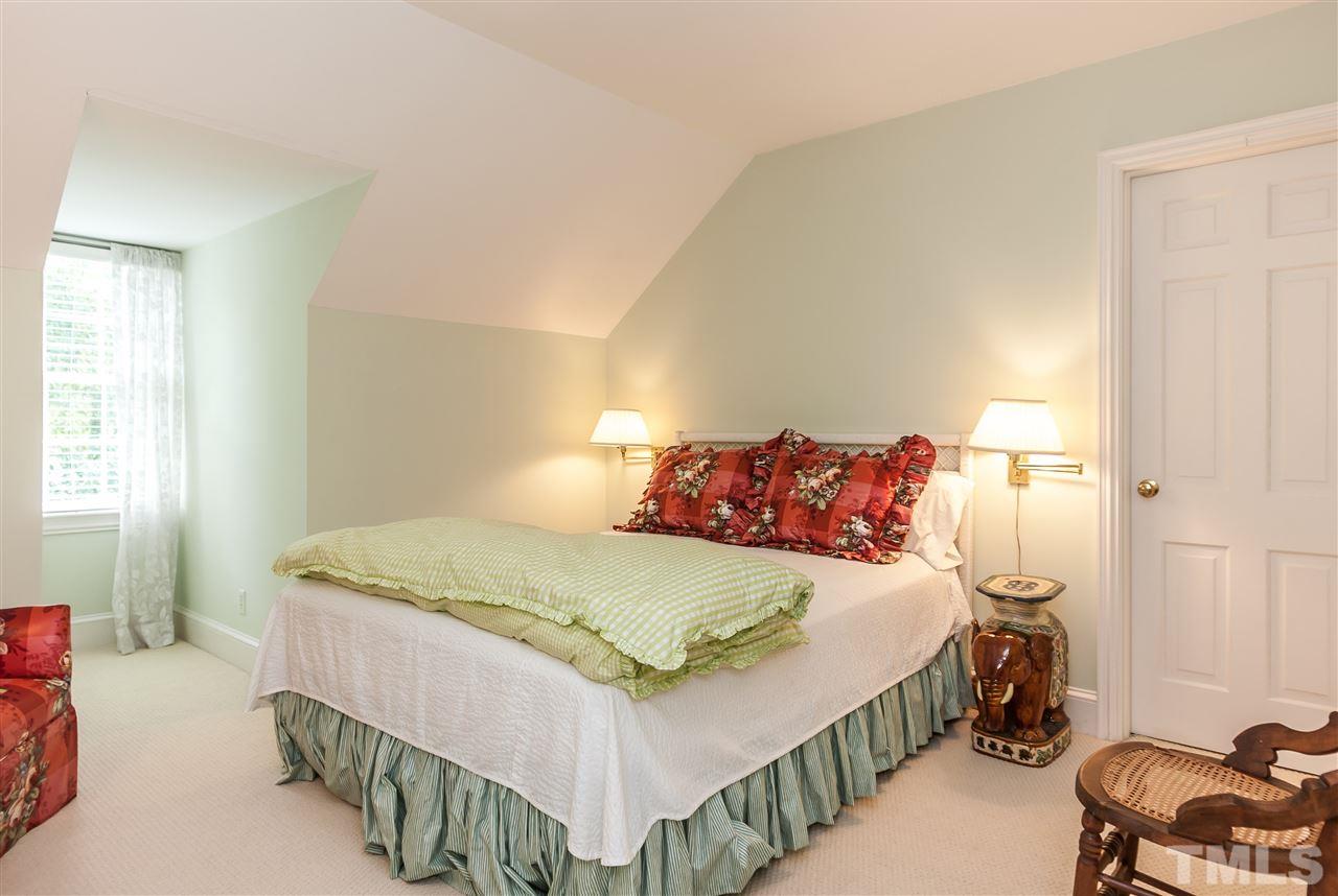3313 Landor Road Raleigh, NC 27609 - Photo 22 of 25 a bedroom with a bed and a window