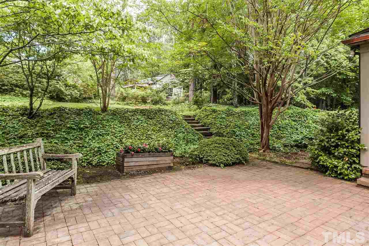 3313 Landor Road Raleigh, NC 27609 - Photo 24 of 25 a backyard of a house with lots of green space