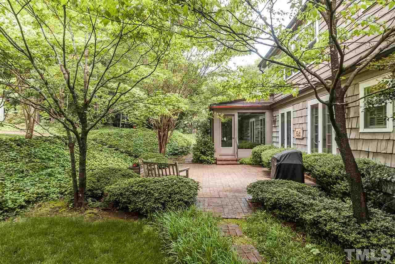 3313 Landor Road Raleigh, NC 27609 - Photo 25 of 25 a view of a house with backyard sitting area and garden