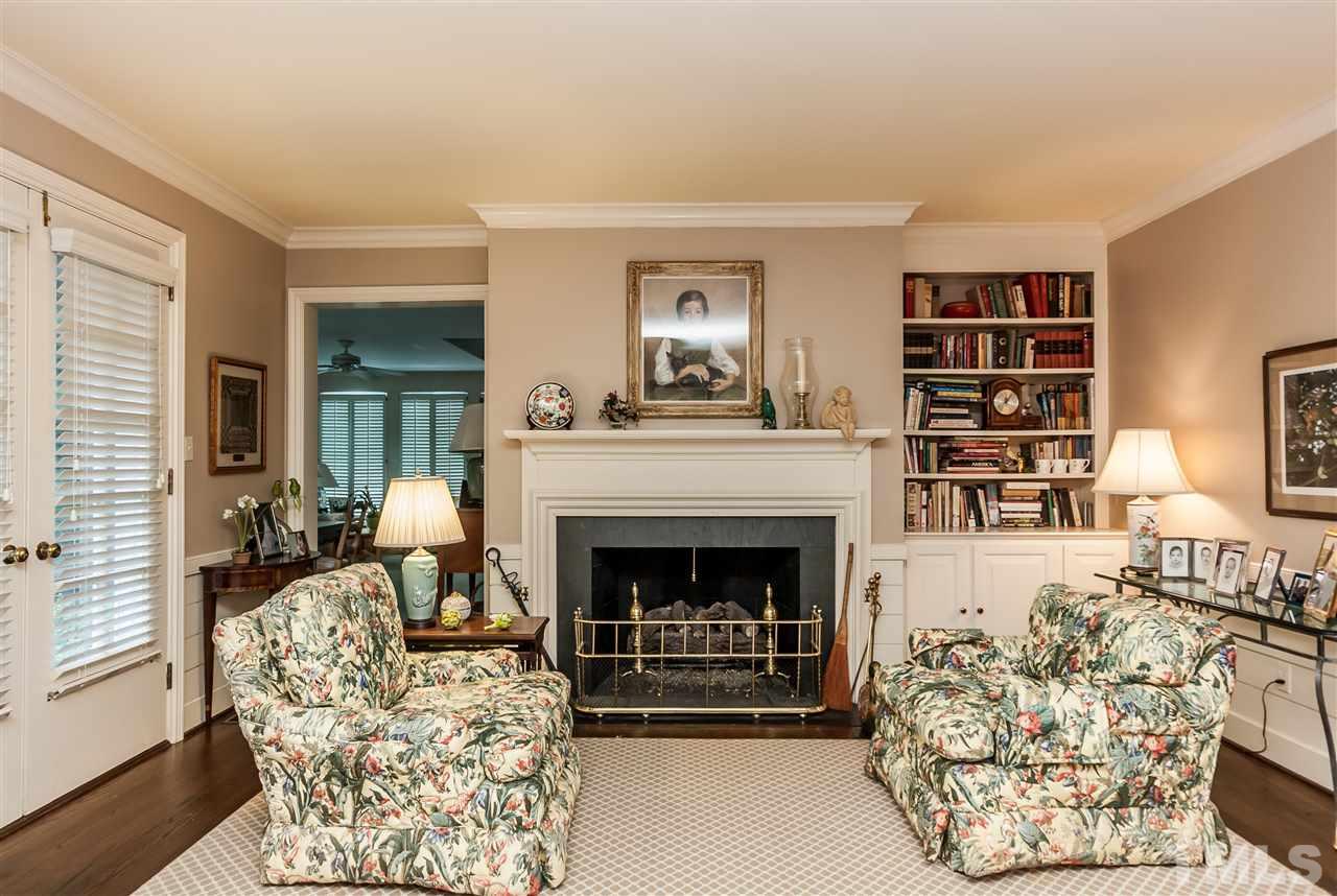 3313 Landor Road Raleigh, NC 27609 - Photo 6 of 25 a living room with furniture and a fireplace