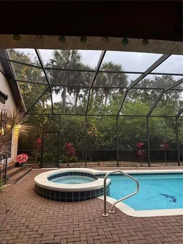a view of a swimming pool with a patio