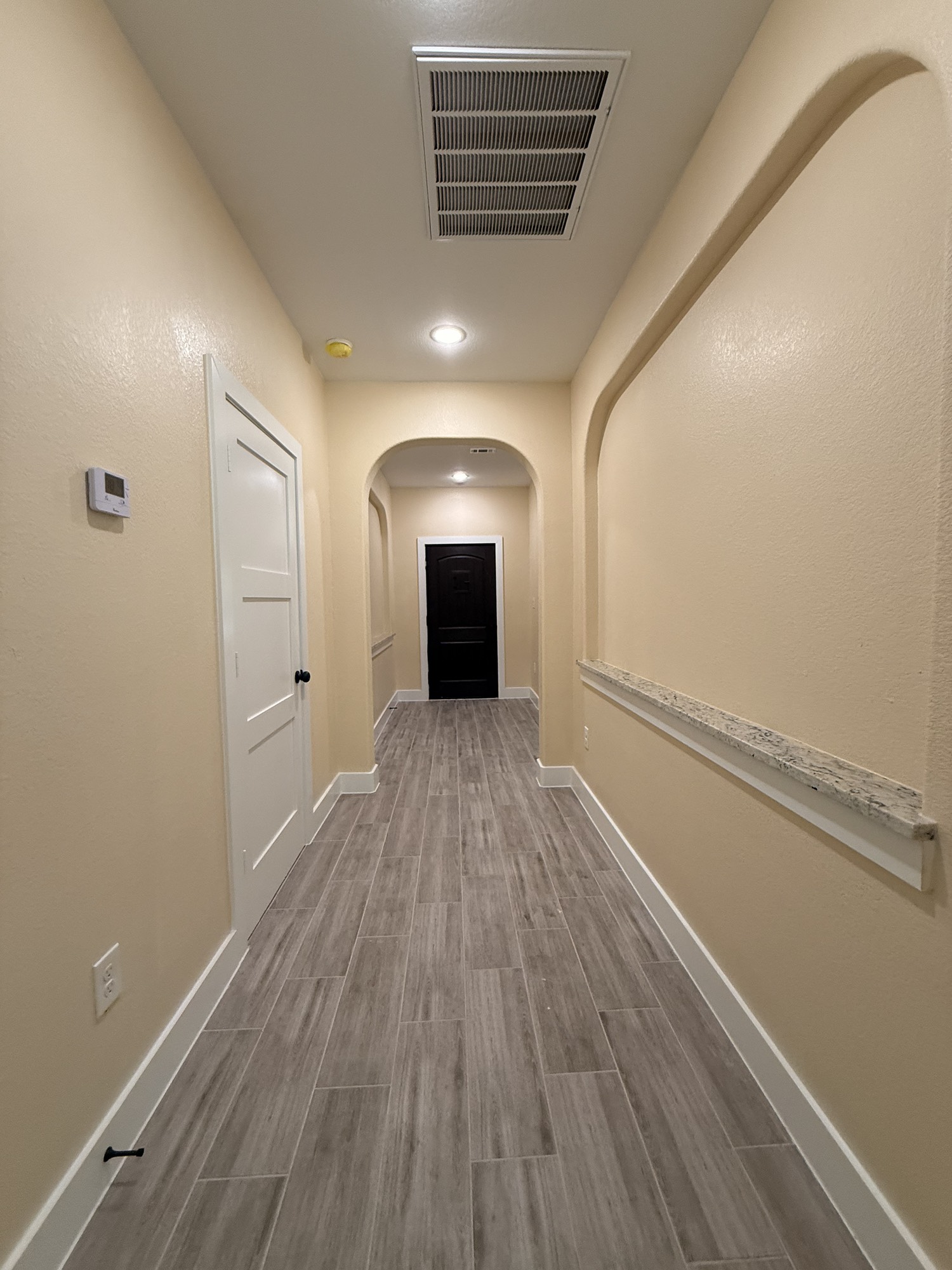 14844 Coaltown Road Willis, TX 77378 - Photo 20 of 30 a view of a room with wooden floors and fireplace