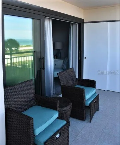 a view of house with swimming pool and patio