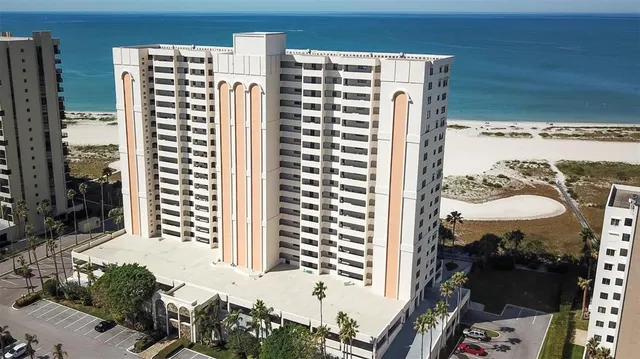 a living room with furniture a large window and a flat screen tv