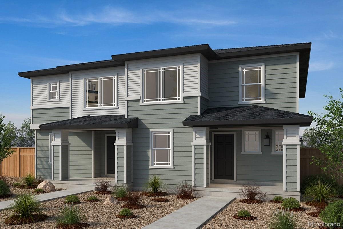 310 Nighthawk Street Erie, CO 80516 - Photo 1 of 2 a front view of a house with garden