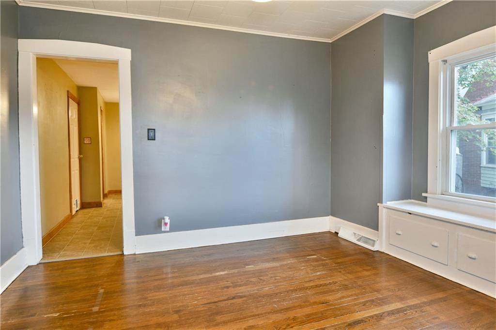 1107 West Ridge Avenue Sharpsville, PA 16150 - Photo 12 of 48 a view of a room with wooden floor and cabinet