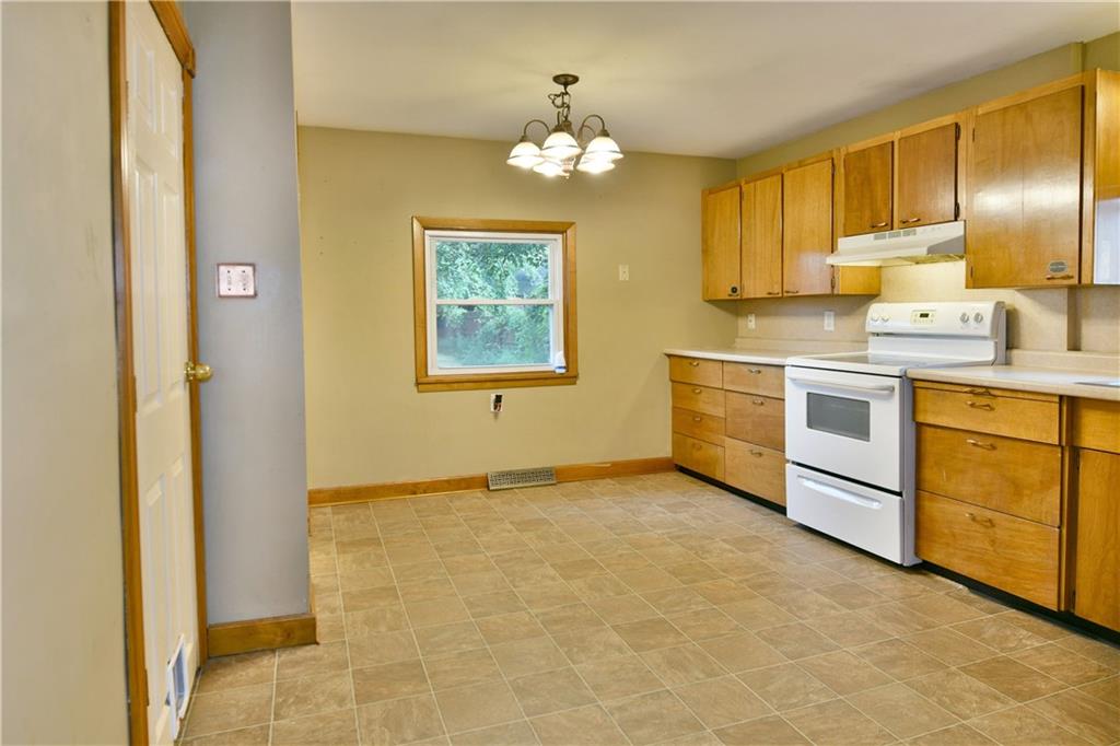 1107 West Ridge Avenue Sharpsville, PA 16150 - Photo 14 of 48 a kitchen with stainless steel appliances granite countertop a stove a sink and a refrigerator