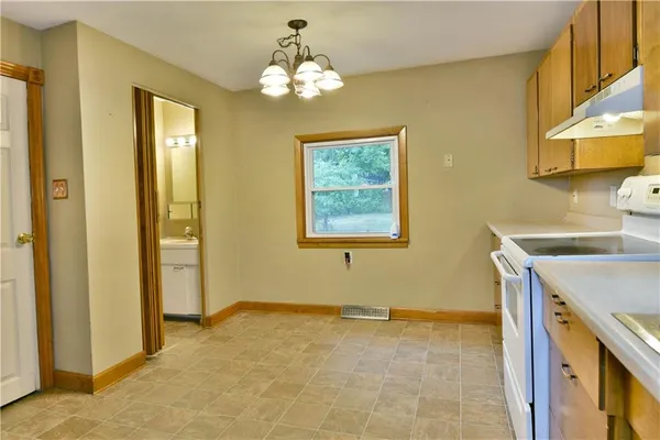 a view of a bathroom with a sink and a mirror