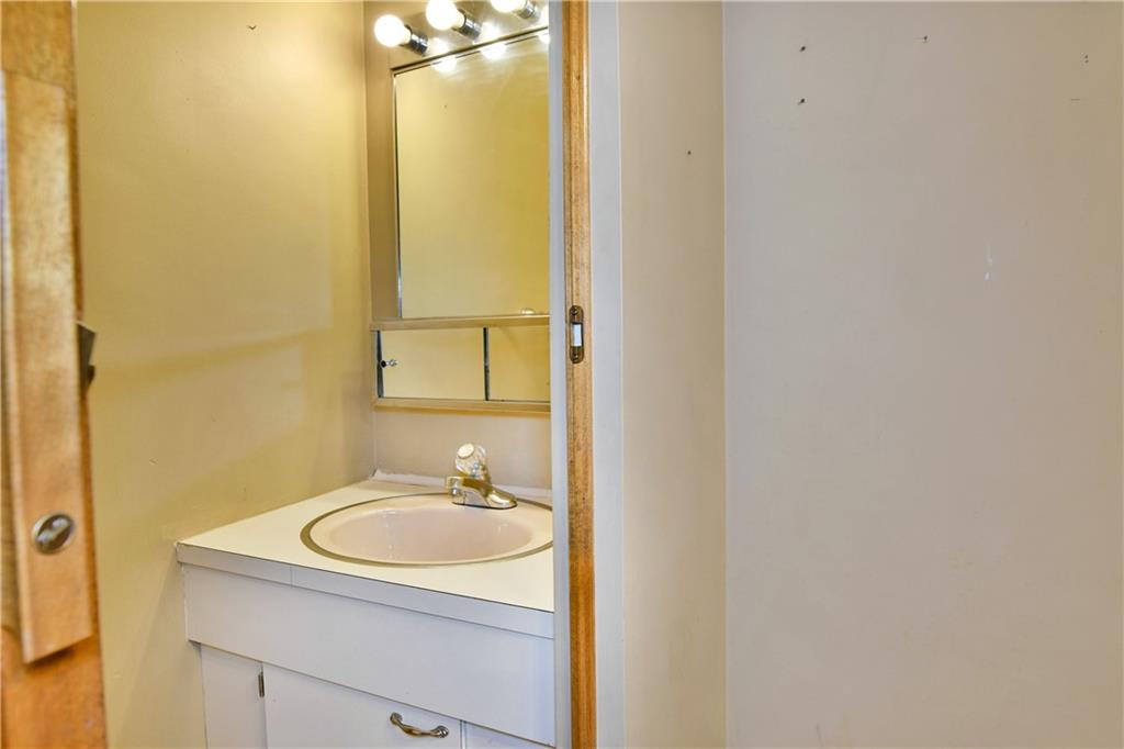 1107 West Ridge Avenue Sharpsville, PA 16150 - Photo 19 of 48 a bathroom with a sink and a mirror
