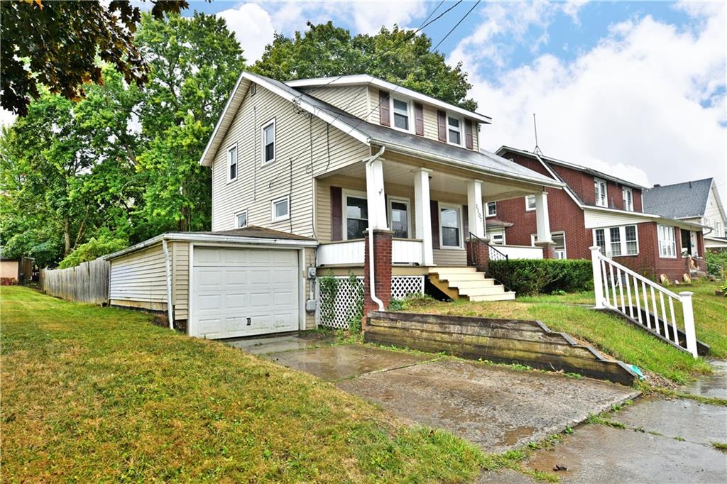 1107 West Ridge Avenue Sharpsville, PA 16150 - Photo 2 of 48 a front view of a house with a yard