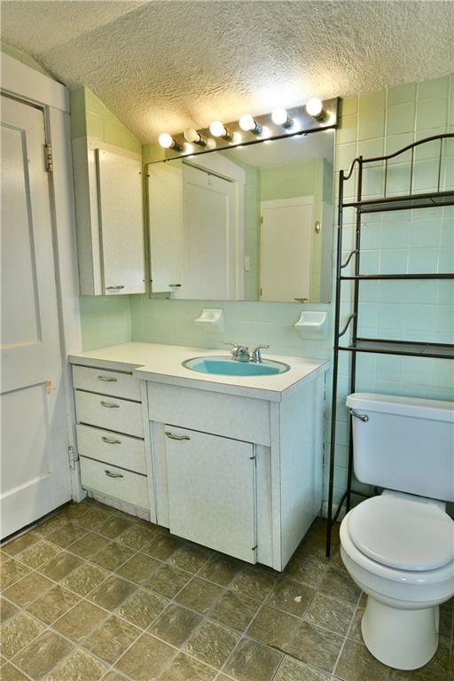 1107 West Ridge Avenue Sharpsville, PA 16150 - Photo 36 of 48 a bathroom with a sink a toilet and shower