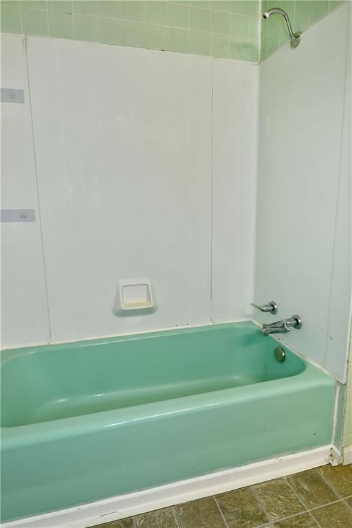 1107 West Ridge Avenue Sharpsville, PA 16150 - Photo 37 of 48 a bathroom with a bathtub and a shower