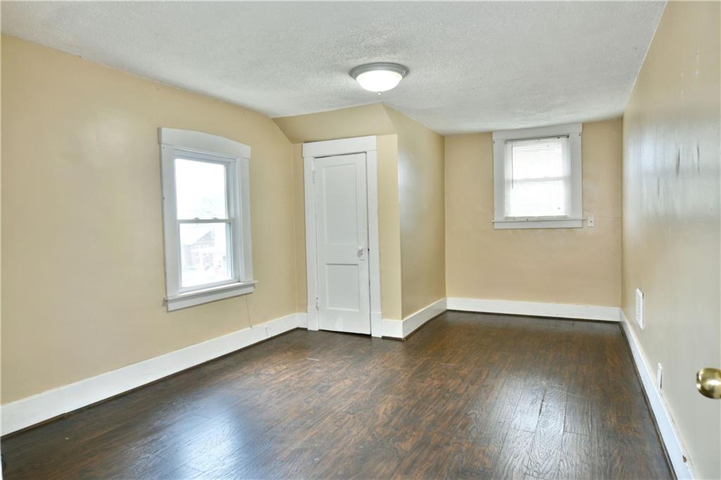 1107 West Ridge Avenue Sharpsville, PA 16150 - Photo 38 of 48 an empty room with wooden floor and windows
