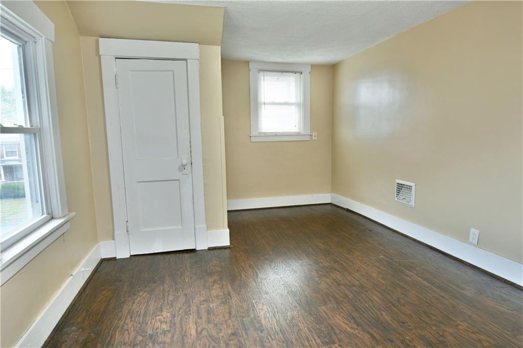 1107 West Ridge Avenue Sharpsville, PA 16150 - Photo 39 of 48 an empty room with wooden floor and windows