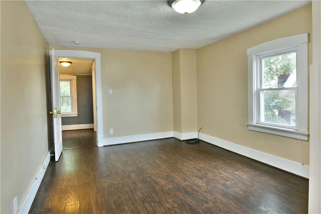 1107 West Ridge Avenue Sharpsville, PA 16150 - Photo 40 of 48 a view of livingroom with hardwood floor and window