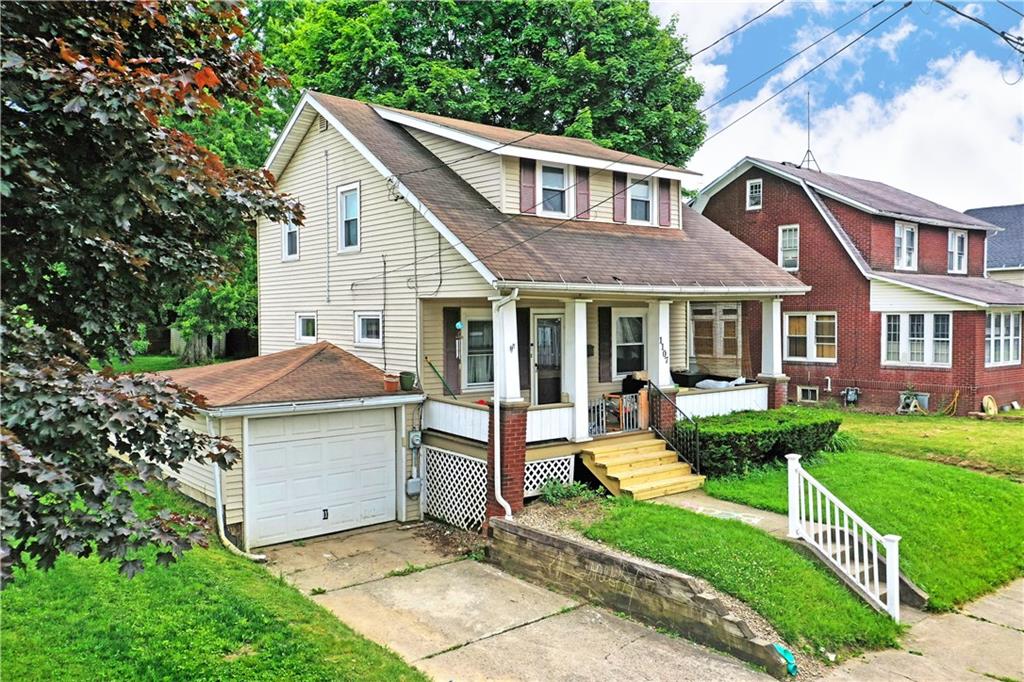 1107 West Ridge Avenue Sharpsville, PA 16150 - Photo 44 of 48 a front view of a house with a yard table and chairs