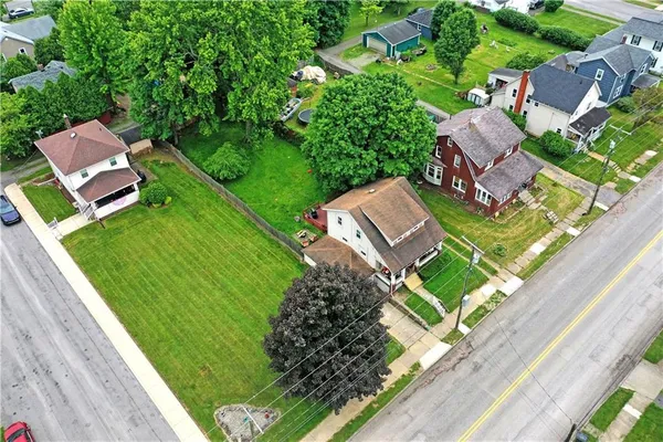 a backyard of a house with lots of green space