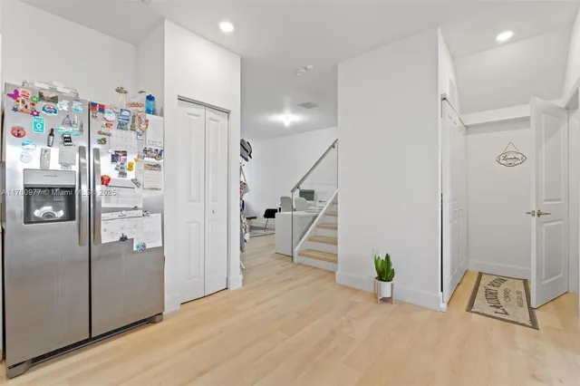 a view of kitchen with furniture and wooden floor
