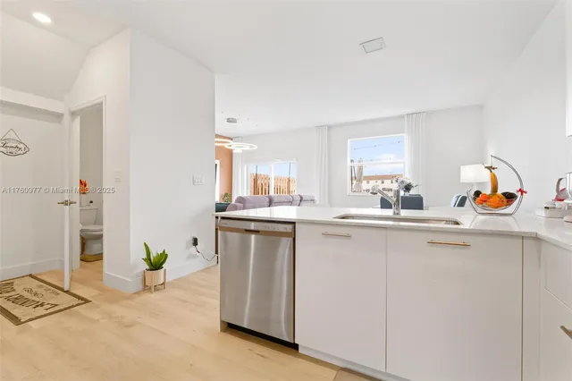 a kitchen with a sink cabinets and counter space