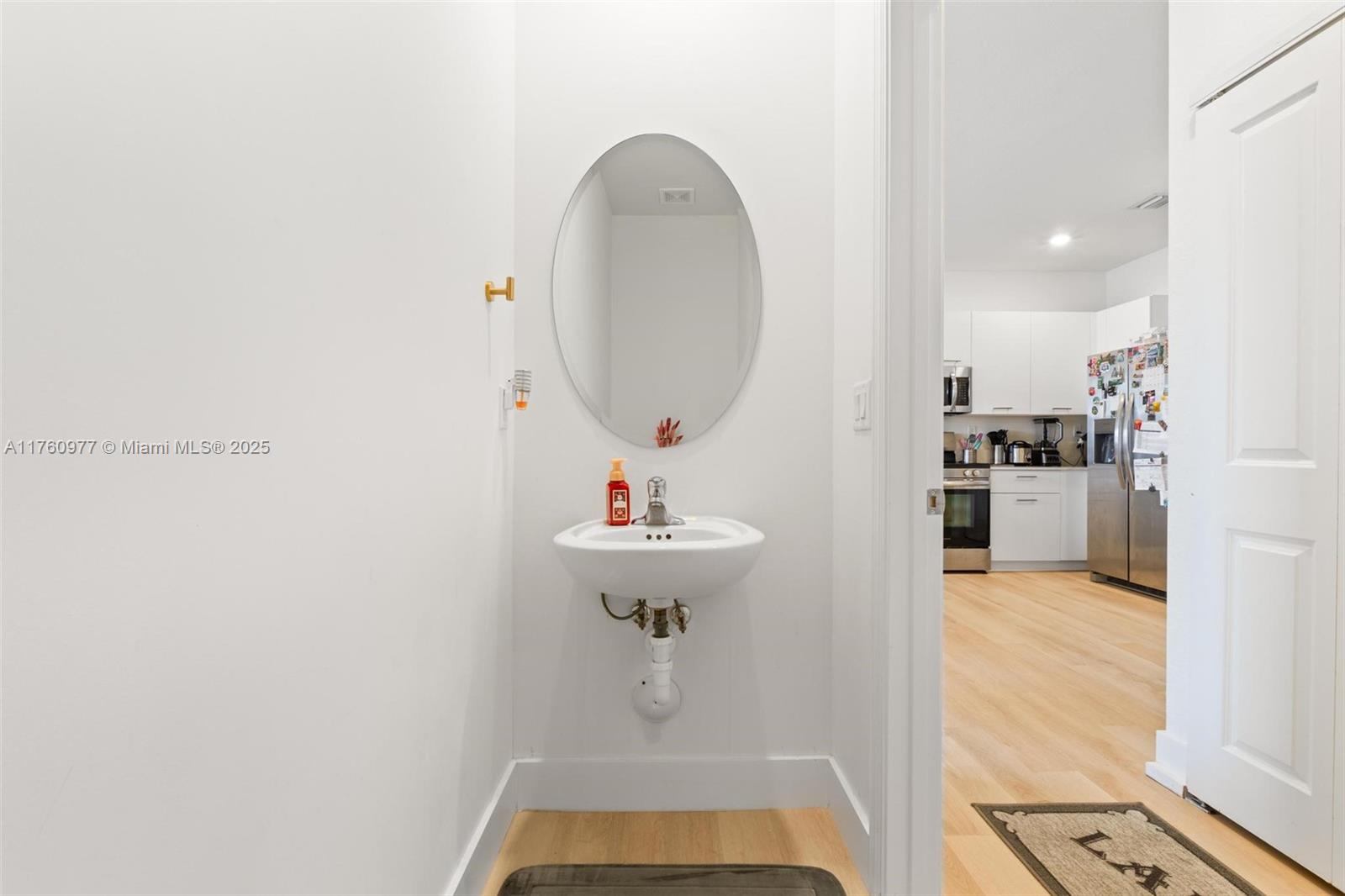 12824 Northwest 22nd Place, Unit 12824 Miami, FL 33167 - Photo 16 of 47 a view of a hallway with wooden floor and staircase