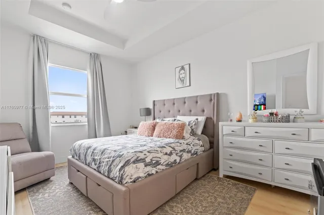 a bedroom with a large bed and a couch